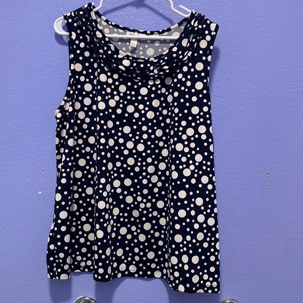 Navy and white polkadotted women’s blouse